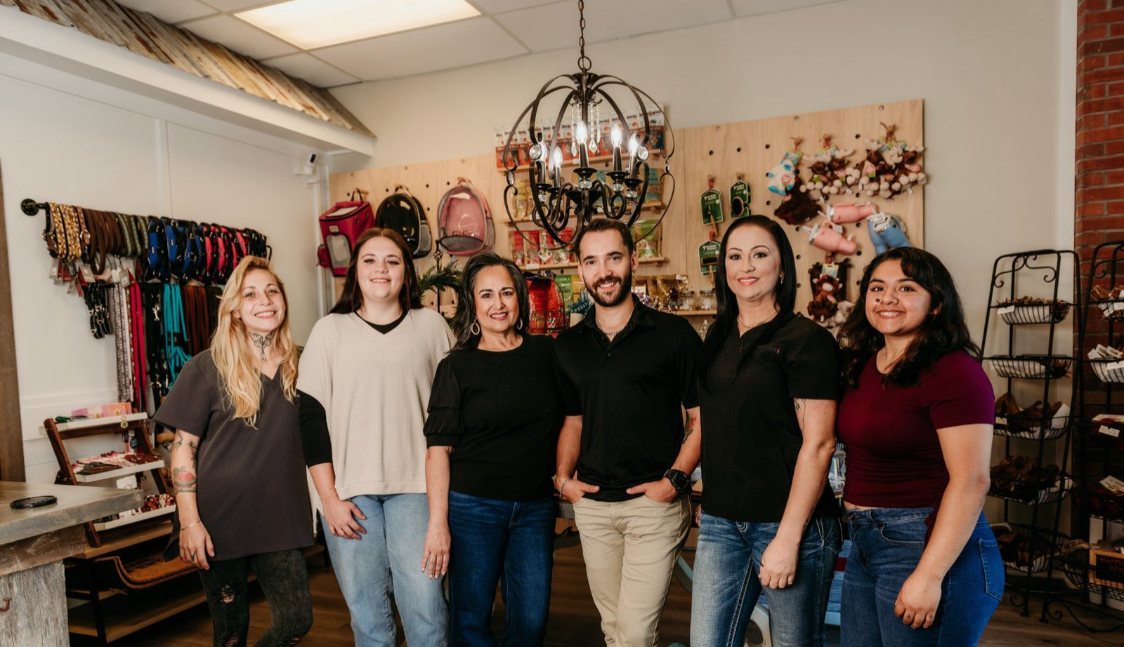The Wags & Wiggles Pet Boutique team together inside the Canton, GA shop