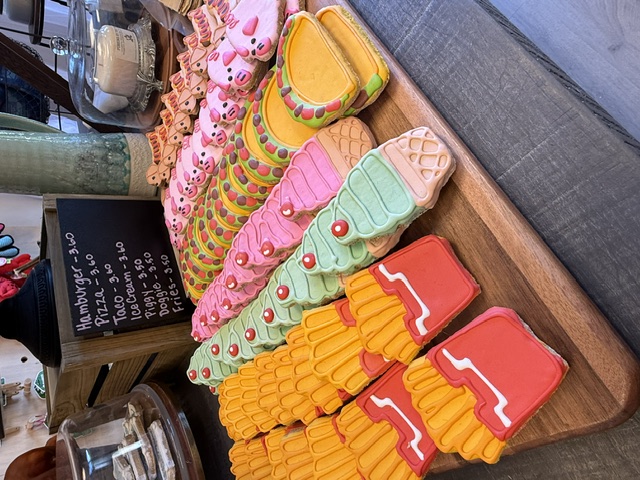 Hand-decorated dog cookies in fun shapes